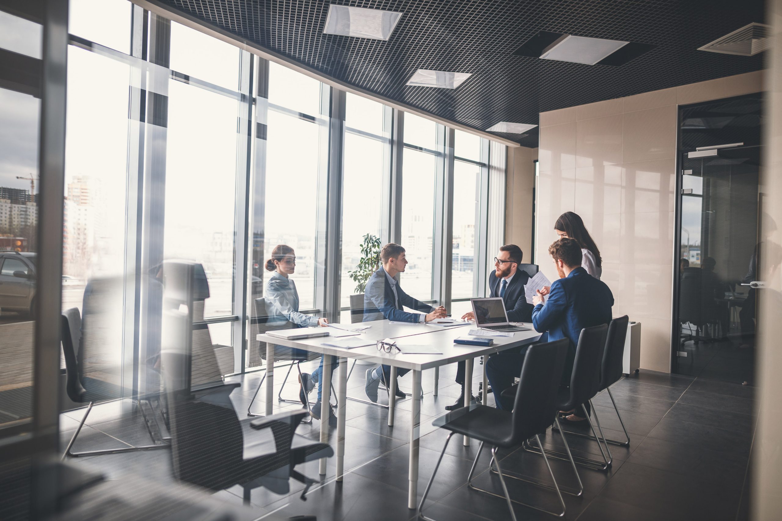 Microsoft-funded workshops webpage banner showing corporate team meeting in busy office environment.